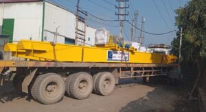A powerful double girder EOT crane with a 50-ton capacity, manufactured by APR Cranes, operating in a large steel plant